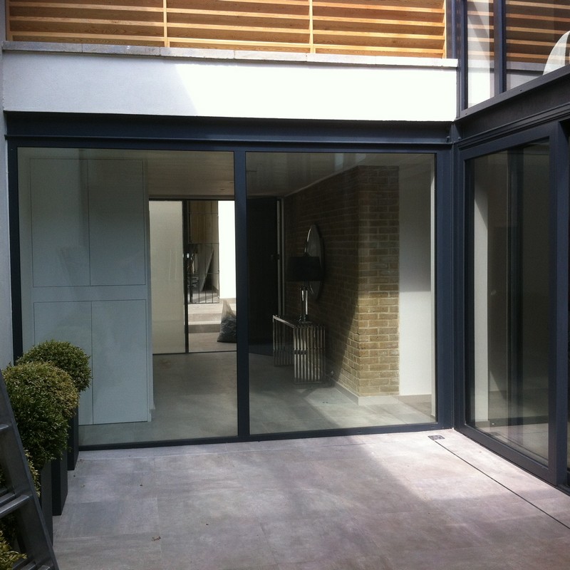 Floor-to-ceiling sliding doors opening to courtyard in Bracknell