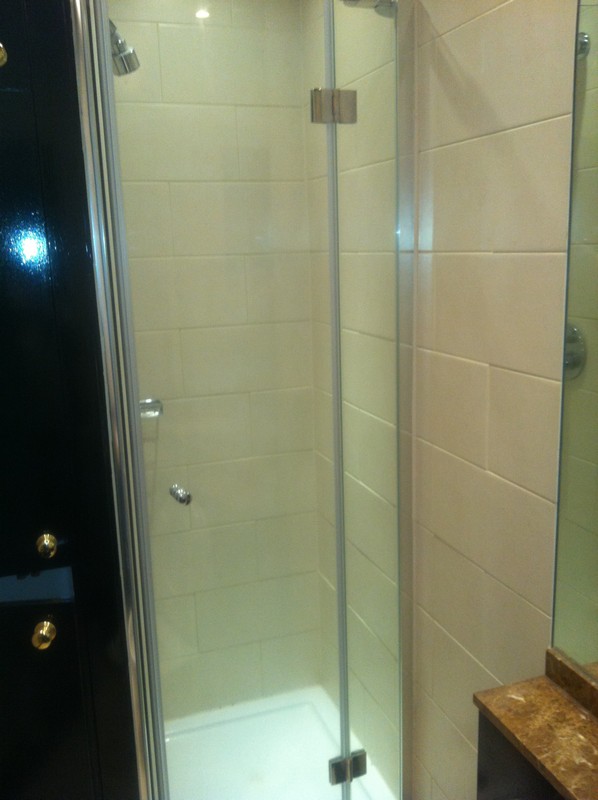 Frameless glass shower enclosure with chrome fittings in Bracknell