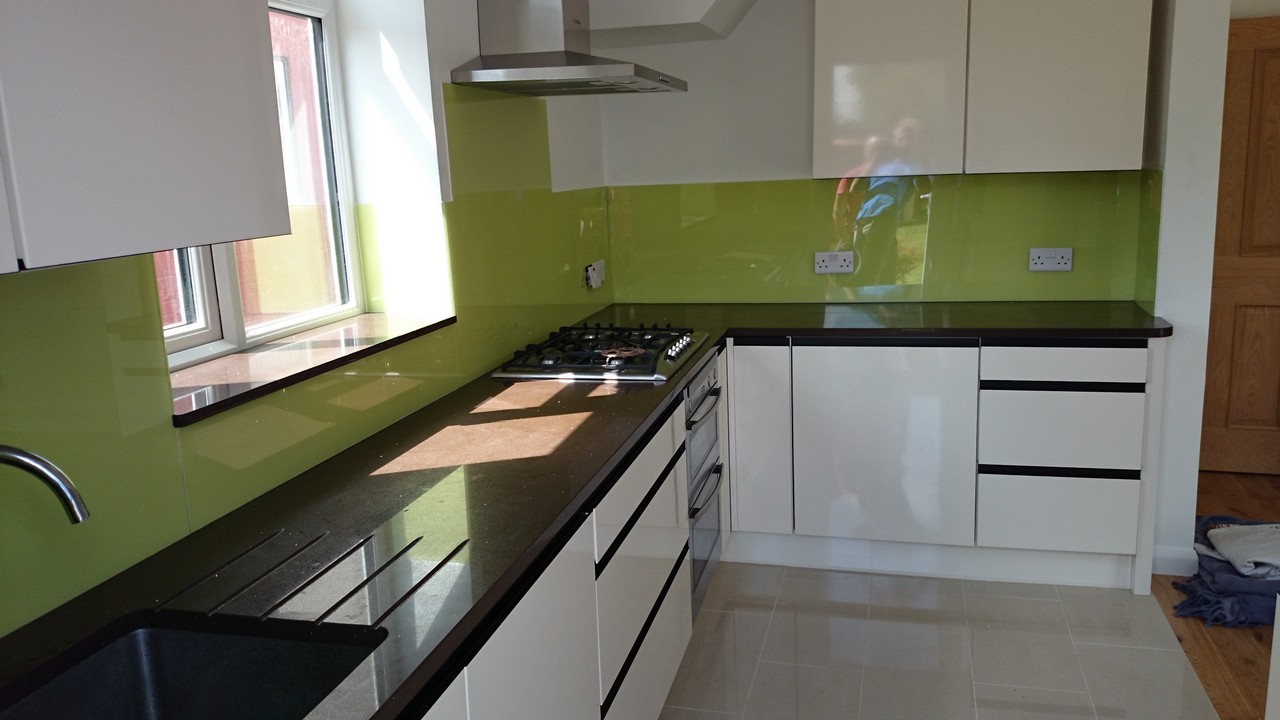 Lime green glass kitchen splashback installed by Bracknell glaziers