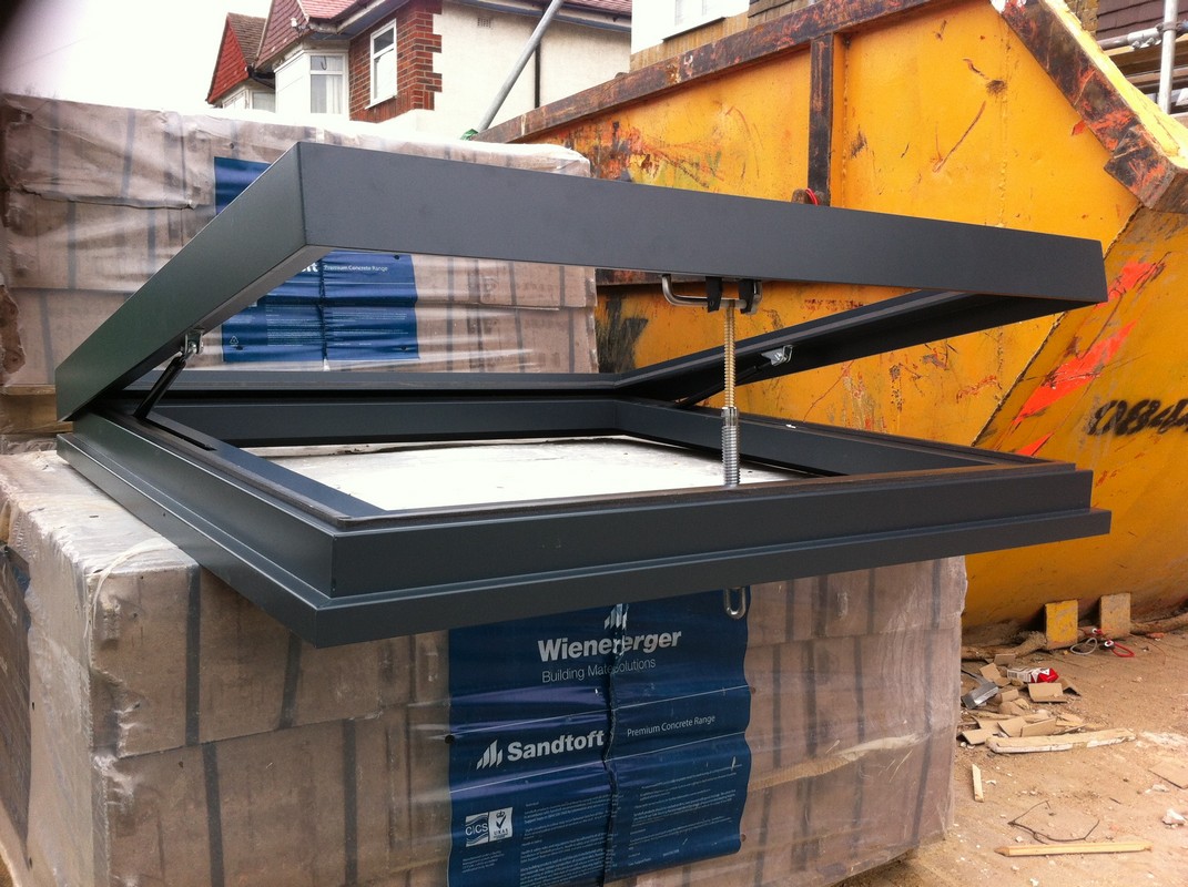 Opening flat roof skylight in anthracite grey installed in Bracknell